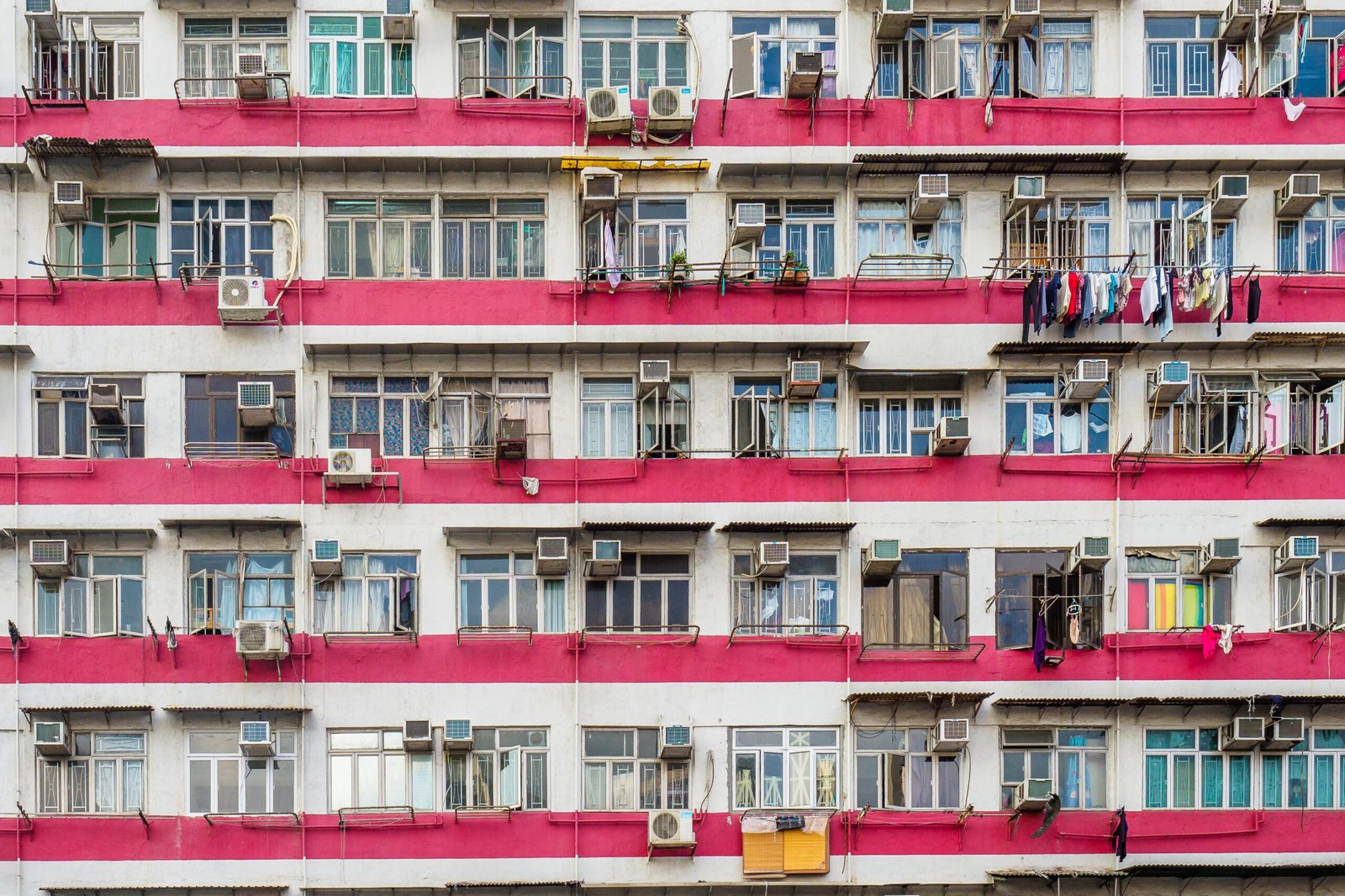 a very tall building with lots of windows and balconies